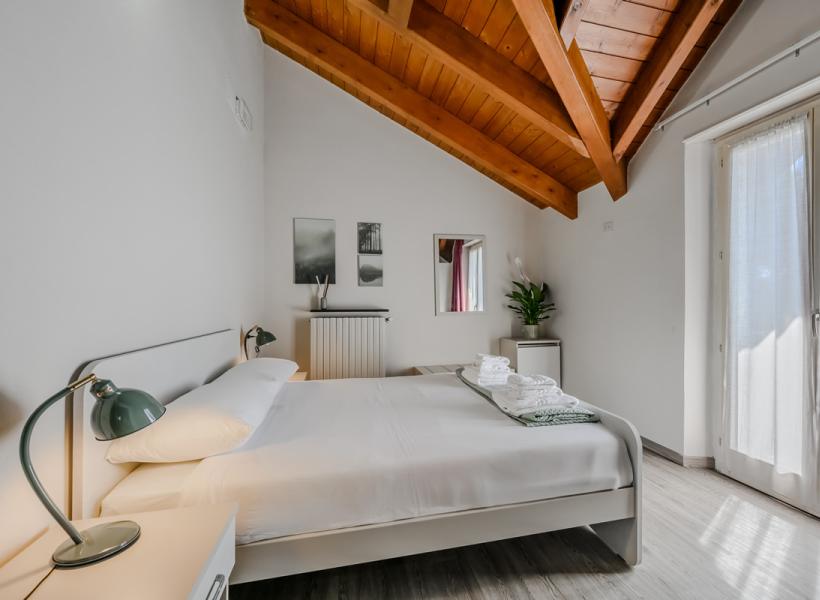 Cozy room with wooden ceiling, natural light, and relaxing atmosphere.